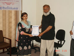 Mr. Imranulla Shariff awarding certificate to Miss. Aisha