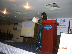 Zara Husain showing a book