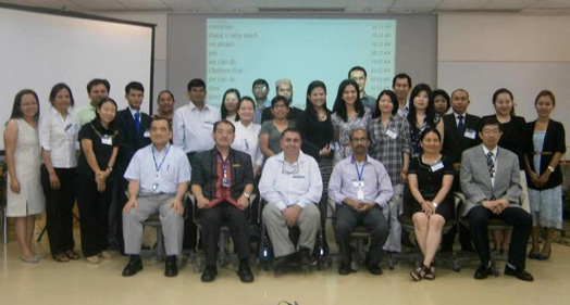 a group photo of organizers with participants at opening of the Workshop